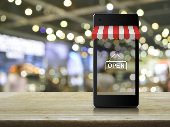 Modern smart mobile phone with on line shopping store graphic an